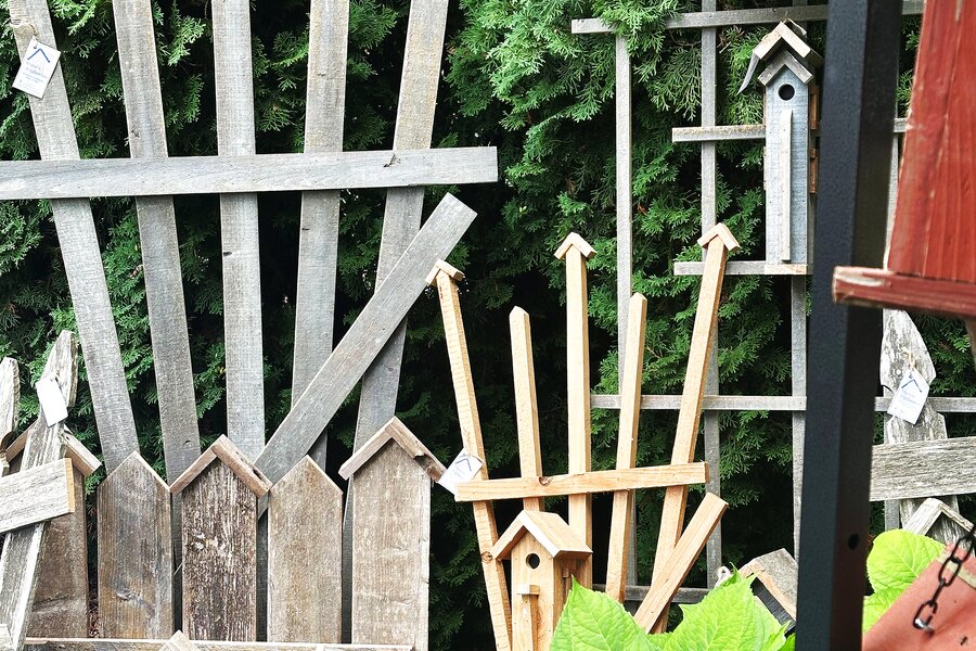 Row of birdhouses on shelf